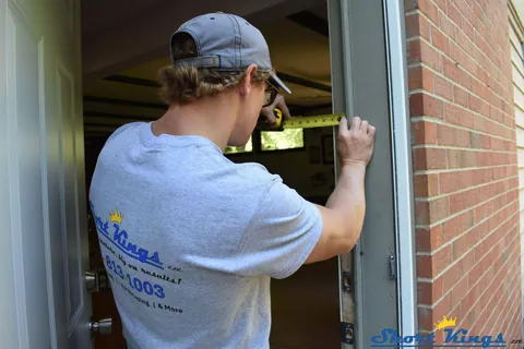 Measuring door trim while wearing a Short Kings shirt